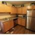 Long Pond Village Apartments, interior, kitchen, stainless steel refrigerator, dishwasher, tan cabinets, wood floor