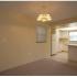 Marcell Gardens Apartments, interior, open concept living room/kitchen, white cabinets, carpet, tile