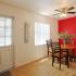 La Aloma Apartments, interior, front door, dining table, red accent wall, ceiling fan