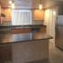 Marcell Gardens Apartments, interior, kitchen, peninsula counter, stainless steel appliances, window,
