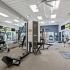 fitness center with weight and cardio machines and free weights