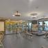 fitness center with cardio and weight machines and free weights