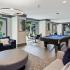 Clubhouse with seating, pool table, and kitchen