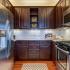 Kitchen with stainless steel appliances and wood cabinets