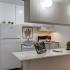 Kitchen with white appliances and white cabinetss