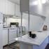 Kitchen with white appliances and white cabinetss