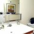 Bathroom with single sink vanity and large mirror at Sterling Glen apartments for rent in Lumberton, NJ