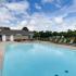 Scenic Station apartments outdoor swimming pool and tanning chairs
