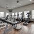 Coryell Crossing Apartments fitness center with hardwood style flooring