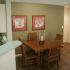 Dining area with table & chairs in two bedroom one bathroom apartment, Georgetown Apartments in Manhattan, Kansas.