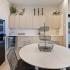 Clubhouse kitchen with table and chairs and coffee machine