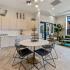 Clubhouse kitchen with table and chairs and sitting area