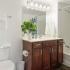 Bathroom with one sink, toilet, and shower