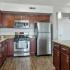 Kitchen with stainless steel appliances and wood cabinets