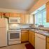 Kitchen with updated white appliances, gas range, dishwasher, microwave, frost free fridge