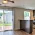 Kitchen fully updated with stainless steel appliances (gas range, dishwasher, microwave, fridge), breakfast bar, walkout patio
