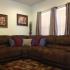 A brown couch with red, white, and blue throw pillows. | On-Base Housing Schriever SFB, CO
