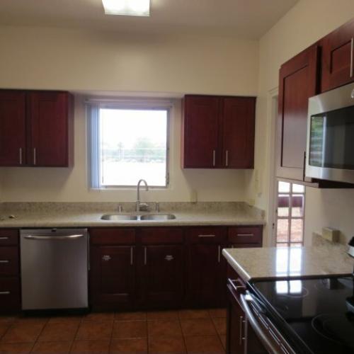 4-Bedroom Senior Officer Home on Schofield Barracks, kitchen with cherry cabinets, stainless appliances