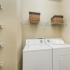 Laundry Room with Shelves  | Apartments On Beltway 8 | Advenir at Wynstone