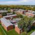 Orchard Estates Apartments, exterior, aerial view of property, numerous large trees, red brick buildings, three levels
