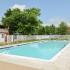 Sparkling outdoor swimming pool at Country Manor apartments for rent