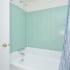 Master Bathroom with tiled tub shower at Naamans Village Apartments in Claymont, DE.