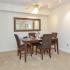 Dining area with a ceiling fan is furnished with a rectangular table and 4 chairs at Summit Trace Apartments in Langhorne, PA.