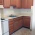 Kitchen with brown cabinets and classic flooring in Lansdale, PA apartment for rent