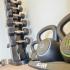 Dumbbells and kettlebells on racks in the fitness center at Suburban Court Apartments in Ardmore, PA.