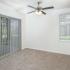 Dining room with a ceiling fan and grey door at Fox Run apartments for rent