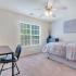 Carpeted Bedroom with Ceiling Fan | Deacon's Station Apartments | 4 Bedroom Apartments In Winston-Salem, NC