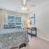 Bedroom with Desk and Large Windows | Deacon's Station Apartments | 4 Bedroom Apartments In Winston-Salem, NC