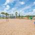 Artisan Living Bella Citta Rental Townhomes playground with equipment and mulched flooring