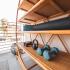 Sora close up bamboo shelving with weights and yoga mat on exterior private balcony