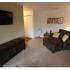 Long Pond Village Apartments, interior, living room, carpeted, natural light, leather lounge chair, tv