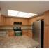 Marcell Gardens Apartments, interior, kitchen, peninsula counter, stainless steel appliances,
