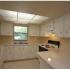 Marcell Gardens Apartments, interior, kitchen, white cabinets and appliances,