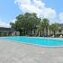 La Aloma Apartments, exterior, sparkling blue swimming pool, trees, lounge chairs, spacious